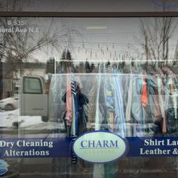 Charm Dry Cleaners logo